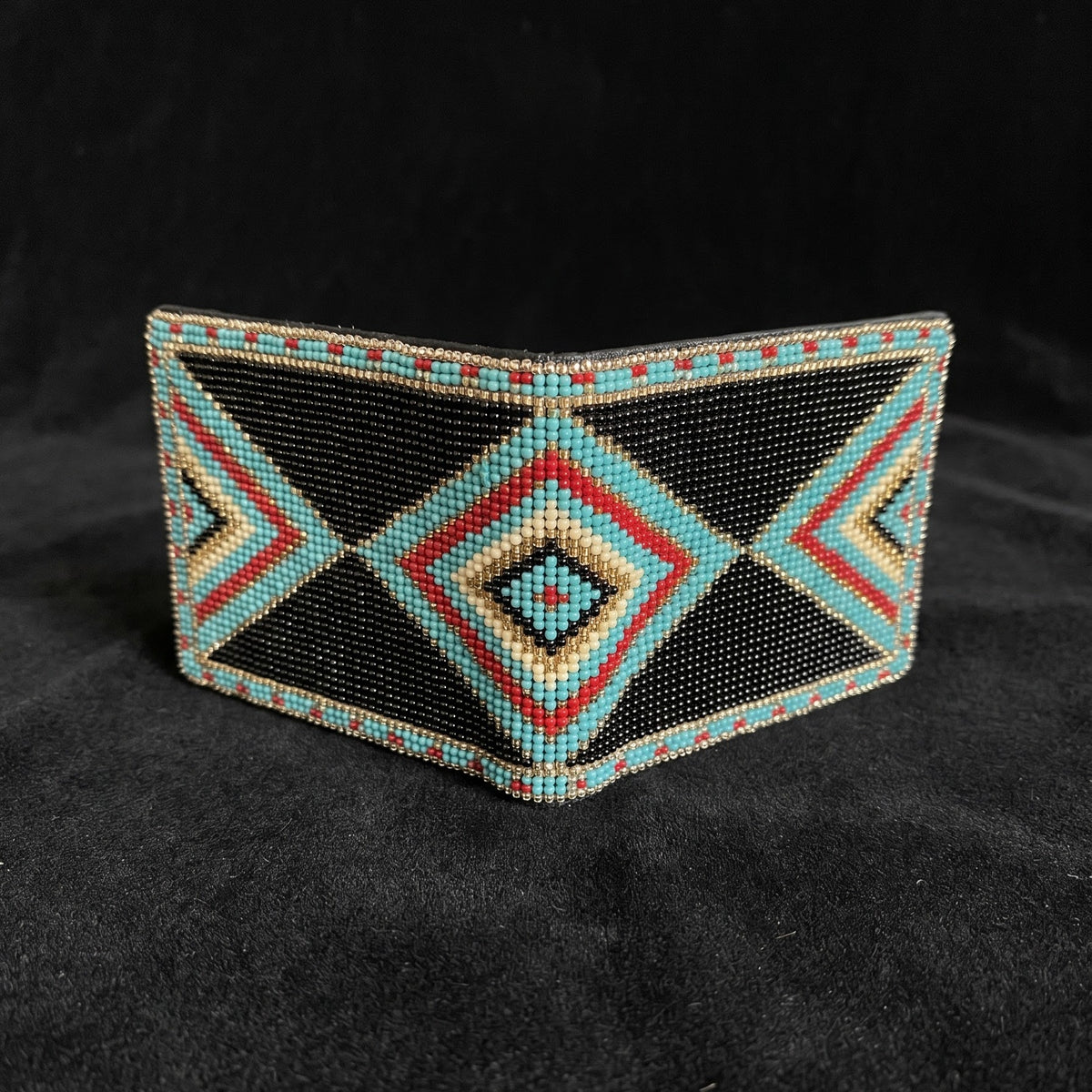 Charcoal beaded leather bifold wallet with turquoise coral cream and slate cross diamond design