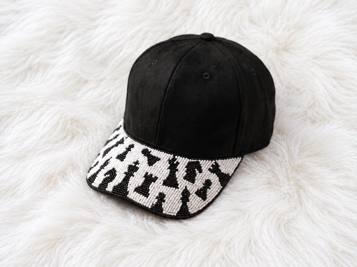Black baseball cap with hand-beaded black-and-white chess pieces on brim