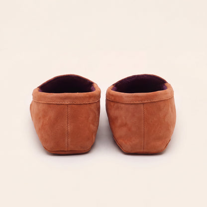Heel and back stitching of coral suede slip-on moccasins with plum lining