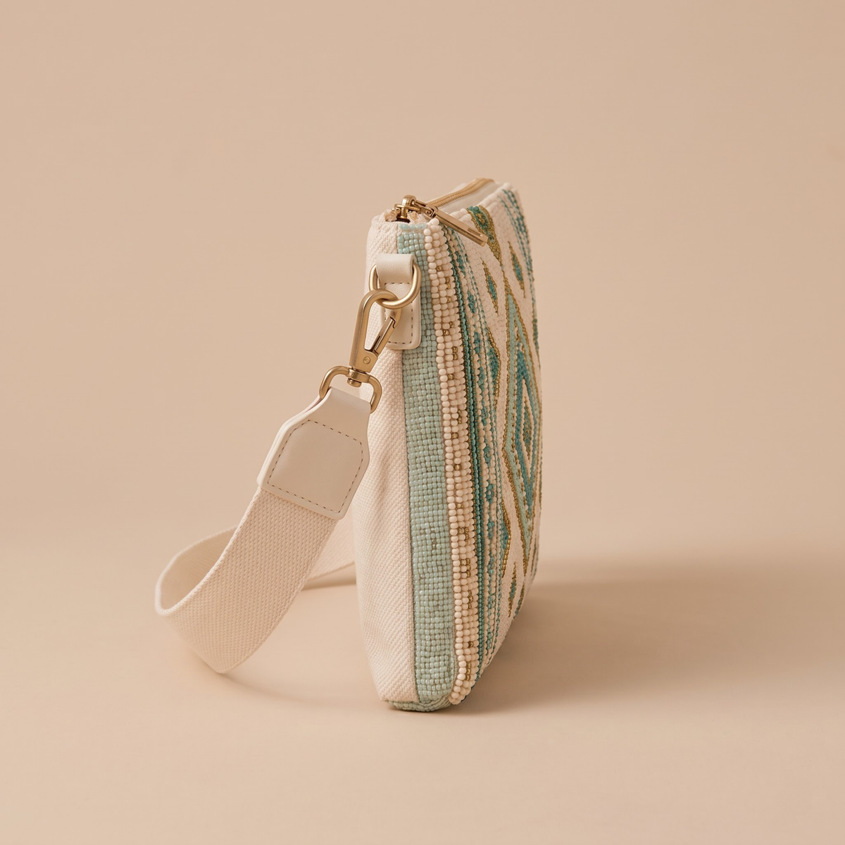 Ivory geometric hand-beaded crossbody bag side view