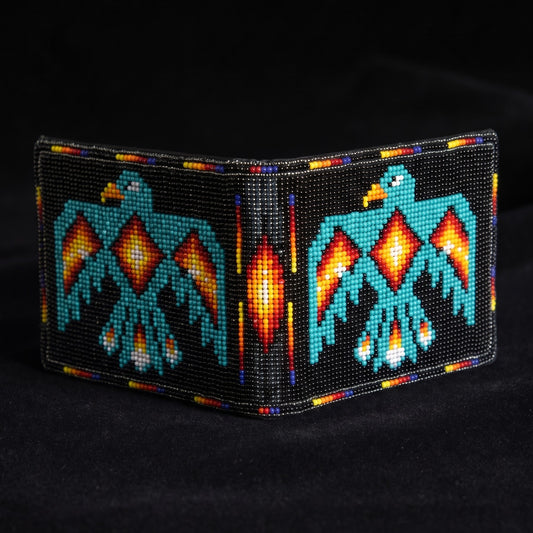Alternate unfolded view of black beaded leather wallet with turquoise Thunderbird design and orange center diamond