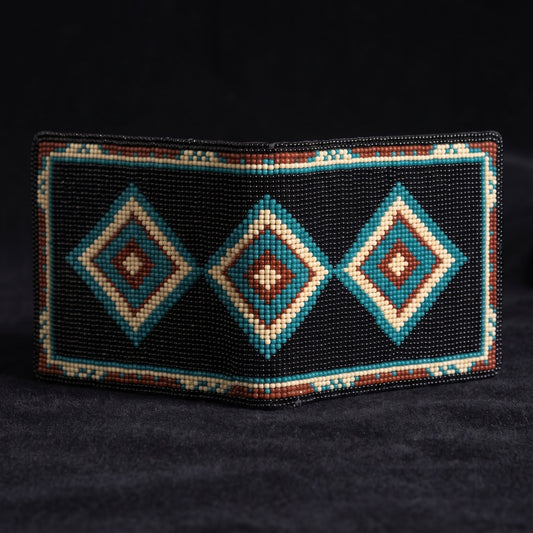 Alternate front view of black beaded leather wallet with three turquoise rust and cream diamonds