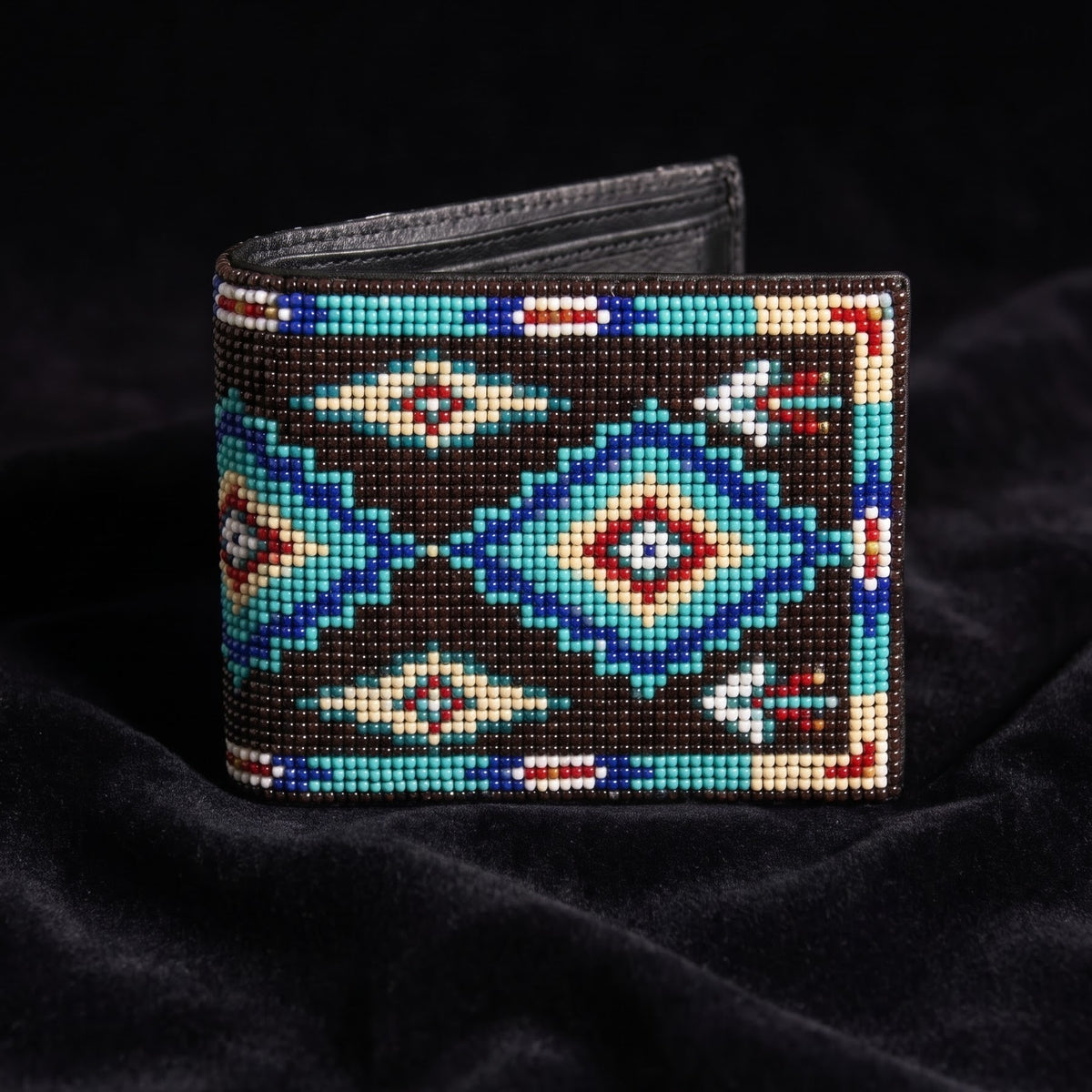 Dark brown hand-beaded leather bifold wallet with turquoise diamond motifs and white black geometric accents