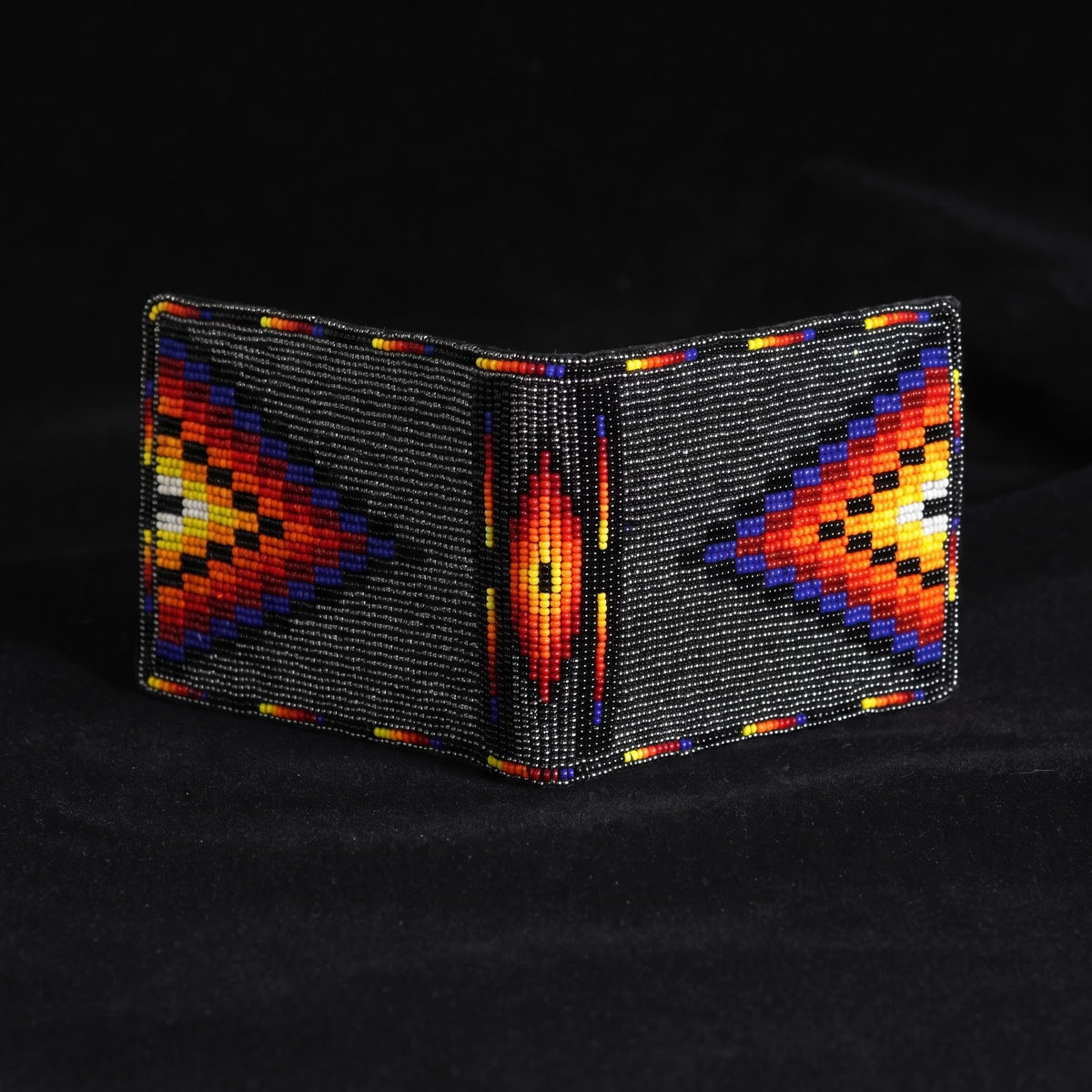 Black leather bifold wallet with orange yellow and blue hand-beaded arrow and center diamond design