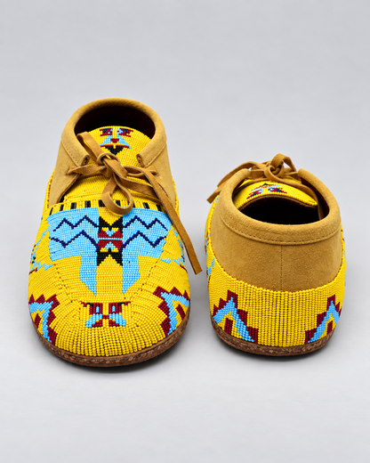 Front and back view of yellow hand-beaded men's moccasins