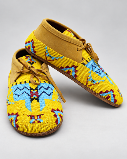 Yellow hand-beaded men's moccasins with mustard suede and blue red geometric beadwork